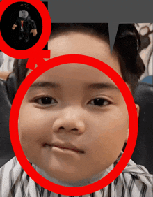 a picture of a baby with a red circle around his face