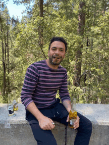 a man smoking a cigar and holding a bottle of corona