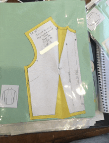 a sewing pattern for a front bodice is on a piece of green paper