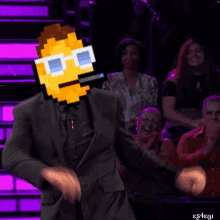 a man in a suit has a pixelated smiley face on his head