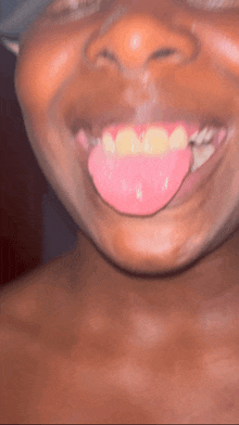 a close up of a person 's tongue sticking out