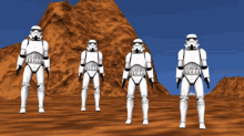 a group of stormtroopers are doing a dab in a desert