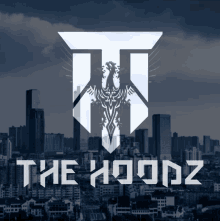 a logo for the hoodz shows a city skyline in the background