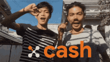 two men standing next to each other with the word cash in orange letters