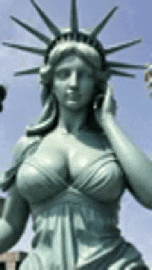 a statue of the statue of liberty with a very large breast .