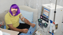 a man in a purple wig is getting a dialysis treatment