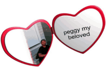 a heart shaped mirror says peggy my beloved on it