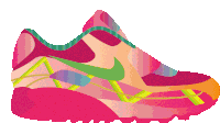 a pink nike shoe with a green swoosh on it