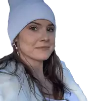 a woman wearing a white beanie and a white fur coat