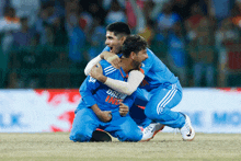 a man in a blue shirt that says dream india