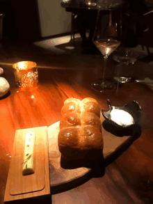 a bunch of bread sits on a wooden cutting board