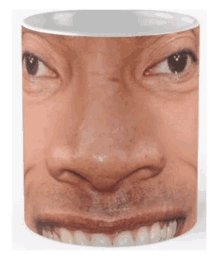 a close up of a man 's face on a coffee mug