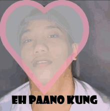 a man 's face is surrounded by a pink heart and the words eh paano kung