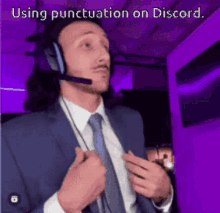 a man wearing a suit and tie is using punctuation on discord .