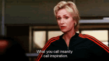 a woman wearing a black and red adidas jacket says what you call insanity i call inspiration