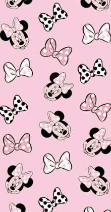 a pink background with minnie mouse faces and bows on it