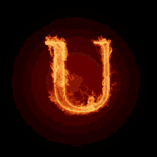 the letter u is on fire on a dark background