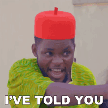 a man wearing a red hat and a green shirt says " i 've told you "