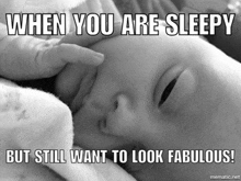 a black and white photo of a baby with a caption that says when you are sleepy but still want to look fabulous