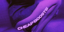 a woman in fishnet stockings is squatting down on a purple background with the words `` cheap boosts '' written on it .