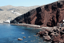 a large body of water surrounded by rocky cliffs and mountains