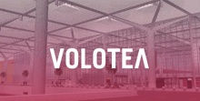 the word volotea is on a pink background with a building in the background