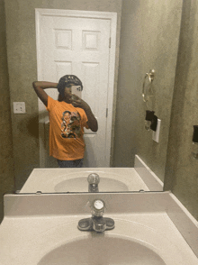 a person is taking a selfie in a bathroom mirror