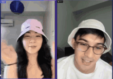 a woman wearing a pink hat and a man wearing a white bucket hat are on a video call