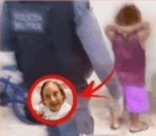 a man in a police uniform is standing next to a little girl .