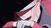 a close up of a girl wearing a hat and gloves from a anime .