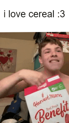 a shirtless man is holding a box of harvest moon benefit cereal .