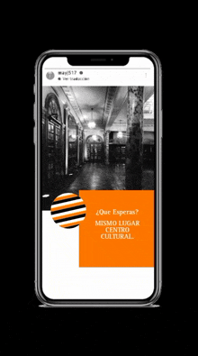 a phone with a picture of a hallway and the words que esperas on it