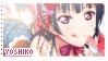 a postage stamp with a picture of a girl with a bow on her hair .