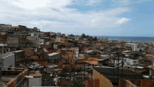 a city with a lot of buildings and a blue sky in the background