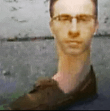 a blurry picture of a man wearing glasses