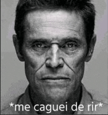 a black and white photo of a man with the words `` me caguei de rir '' written on his face .