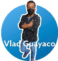 a man wearing a mask is standing in front of a blue circle with vlad guayaco written on it