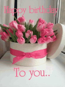 a box of pink flowers with the words happy birthday to you written on it