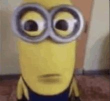 a close up of a minion wearing goggles .