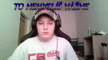 a young boy wearing headphones and a hat with the words to nemyslis vazne above him