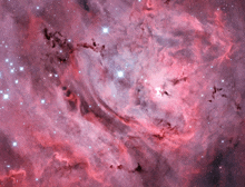 a picture of a pink and purple nebula with stars