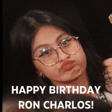 a girl with glasses is making a funny face with the words happy birthday ron carlos below her