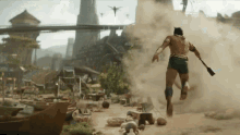 a man running with a spear in his hand