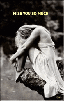 a black and white photo of a woman sitting on a rock with the words " miss you so much " above her