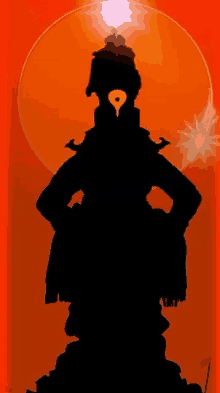 a silhouette of a statue of a deity standing in front of a sun