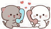 two cats are talking on a telephone with hearts .