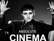 a black and white photo of a man with the words absolute cinema on the bottom