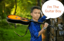 a boy is holding a guitar with a speech bubble that says i 'm the guitar boy