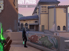 a man standing in front of a building that says buy phase on it