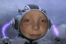 a child 's face is reflected in a futuristic helmet with purple wires coming out of it